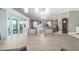 View from the dining table towards the living room with access to the outdoor patio at 488 Seth Run, The Villages, FL 32163