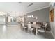Dining room featuring a large wooden table and chairs, with views into the kitchen at 488 Seth Run, The Villages, FL 32163