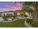 Charming single-story home with a three-car garage, well-manicured landscaping, and a paver walkway leading to the front entrance at 488 Seth Run, The Villages, FL 32163
