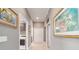 Hallway with neutral color palette and tile flooring, creating a clean and inviting space at 488 Seth Run, The Villages, FL 32163