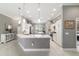 Bright, open kitchen featuring a large island, pendant lighting, and modern appliances at 488 Seth Run, The Villages, FL 32163