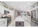 Modern kitchen featuring a large island and stainless steel appliances at 488 Seth Run, The Villages, FL 32163