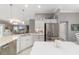 Modern kitchen featuring a large island and stainless steel appliances at 488 Seth Run, The Villages, FL 32163