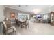 Open floor plan featuring living, dining, and sitting areas in a brightly lit home at 488 Seth Run, The Villages, FL 32163