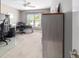 This office space features two black desk chairs, area rug, and a window with lots of natural light at 488 Seth Run, The Villages, FL 32163