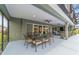 Outdoor covered patio featuring a wrought iron dining table for entertaining at 488 Seth Run, The Villages, FL 32163
