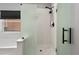 Modern bathroom featuring glass shower with black hardware and fixtures at 5133 Sw 41St Pl, Ocala, FL 34474