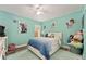 Bright bedroom features calming paint, ceiling fan, and natural light through window at 5133 Sw 41St Pl, Ocala, FL 34474