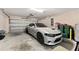 Garage with a silver car parked inside at 5133 Sw 41St Pl, Ocala, FL 34474
