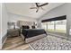 Spacious main bedroom with vaulted ceiling, a large window, and stylish furnishings at 5133 Sw 41St Pl, Ocala, FL 34474