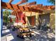 Outdoor picnic area with wooden tables, red umbrellas, and convenient access to water fountains at 5133 Sw 41St Pl, Ocala, FL 34474