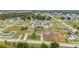 Wide aerial shot of neighborhood with mix of mature trees and newer construction at 63 Walnut Crse, Ocala, FL 34480