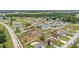 Wide aerial view of the neighborhood and adjacent wooded area at 63 Walnut Crse, Ocala, FL 34480