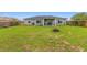 Spacious backyard with covered patio area, perfect for entertaining and outdoor enjoyment at 63 Walnut Crse, Ocala, FL 34480