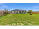 The home features a well-sized backyard, perfect for outdoor activities and relaxation at 63 Walnut Crse, Ocala, FL 34480