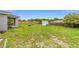Spacious backyard including a storage shed, ideal for outdoor activities at 63 Walnut Crse, Ocala, FL 34480