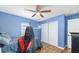 Cozy bedroom featuring wood floors, a ceiling fan, and a closet at 63 Walnut Crse, Ocala, FL 34480