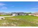 Beautiful single-story home featuring a lush lawn and a paved driveway, with lovely curb appeal at 63 Walnut Crse, Ocala, FL 34480