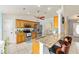 Open kitchen featuring granite countertops, stainless steel appliances, and a breakfast bar with seating at 63 Walnut Crse, Ocala, FL 34480