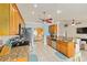Spacious kitchen with tile floors, stainless steel appliances, and granite countertops at 63 Walnut Crse, Ocala, FL 34480