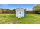 Storage shed located in the spacious, fenced backyard; perfect for storing tools and equipment at 63 Walnut Crse, Ocala, FL 34480
