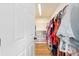 Walk-in closet with built-in shelving and ample storage for clothes and accessories at 63 Walnut Crse, Ocala, FL 34480