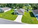 A single-story home with a well-manicured lawn and driveway situated amongst green lawns and neighborhood streets at 7133 Sw 135Th Pl, Ocala, FL 34473
