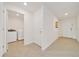Hallway with access to laundry room and front door at 7133 Sw 135Th Pl, Ocala, FL 34473