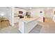 Modern kitchen features stainless steel appliances, granite countertops, and an island with a sink at 7133 Sw 135Th Pl, Ocala, FL 34473