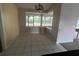 Dining area with tile flooring and sliding glass doors at 8100 Sw 56Th Ter, Ocala, FL 34476