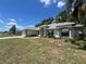 Charming single-story home with mature trees and well-maintained lawn and a front entry two car garage at 8100 Sw 56Th Ter, Ocala, FL 34476