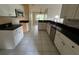 Kitchen with white cabinets, black countertops, and stainless-steel appliances at 8100 Sw 56Th Ter, Ocala, FL 34476
