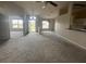 Inviting living room with plush carpeting, and large windows letting in lots of natural light at 8100 Sw 56Th Ter, Ocala, FL 34476