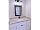Stylish bathroom vanity with granite countertops, modern fixtures, and black hardware accents at 8289 Se 159Th Ln, Summerfield, FL 34491