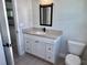 Bathroom boasts granite countertops, modern hardware, and a toilet for added convenience at 8289 Se 159Th Ln, Summerfield, FL 34491