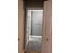 Bathroom with a door opening featuring grey tile floors and grey walls at 8298 Sw 79Th Cir, Ocala, FL 34476