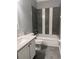 Modern bathroom featuring a tub with tiled wall accents and updated vanity at 8298 Sw 79Th Cir, Ocala, FL 34476