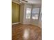 Bedroom with natural light from multiple windows and featuring wood flooring at 8298 Sw 79Th Cir, Ocala, FL 34476