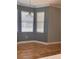 Inviting dining area featuring hardwood floors, crown moulding, and bright windows at 8298 Sw 79Th Cir, Ocala, FL 34476