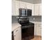 Modern kitchen features stainless steel appliances, sleek countertops, and white cabinets at 8298 Sw 79Th Cir, Ocala, FL 34476