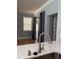 Open concept kitchen featuring hardwood floors, quartz counters, and a stainless sink at 8298 Sw 79Th Cir, Ocala, FL 34476
