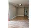 Neutral living room with modern light fixture, fresh paint, and sliding closet doors at 8298 Sw 79Th Cir, Ocala, FL 34476