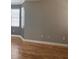 Spacious living room featuring hardwood floors, baseboard trim, and neutral paint at 8298 Sw 79Th Cir, Ocala, FL 34476