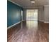 Spacious living room featuring wood floors, recessed lighting, and access to a sunroom at 8298 Sw 79Th Cir, Ocala, FL 34476
