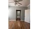 Large main bedroom featuring an ensuite bathroom, hardwood floors, and crown molding at 8298 Sw 79Th Cir, Ocala, FL 34476