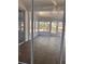 Bright sunroom features tile flooring, ample windows, and access to the backyard at 8298 Sw 79Th Cir, Ocala, FL 34476