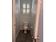 Powder room features a toilet and window with white shutters at 8298 Sw 79Th Cir, Ocala, FL 34476