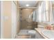 Well-lit bathroom featuring a glass enclosed shower, sink with vanity, and linen cabinet at 8732 Sw 60Th Cir, Ocala, FL 34476