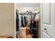 Walk-in closet with hanging rods, shelving, and ample storage for clothing and accessories at 8732 Sw 60Th Cir, Ocala, FL 34476