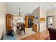 The dining area is open to the kitchen and living room and has wood and tile floors at 8732 Sw 60Th Cir, Ocala, FL 34476